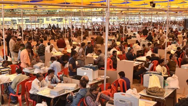Madhya Pradesh elections 2018: Employees on poll duty check materials ahead of election at Lal parade ground in Bhopal on November 27.(Mujeeb Faruqui/HT Photo) Madhya Pradesh elections 2018: Employees on poll duty check materials ahead of election at Lal parade ground in Bhopal on November 27.(Mujeeb Faruqui/HT Photo)