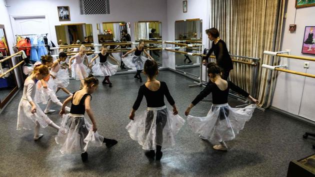They are overwhelmingly girls, their long hair tied tightly in buns high on their heads. “We have boys, but unfortunately not many,” the studio’s director and former ballerina Oksana Mironova tells AFP. She proudly adds that one boy she taught is now a dancer at the historic Bolshoi Theatre. (Mladen Antonov / AFP) They are overwhelmingly girls, their long hair tied tightly in buns high on their heads. “We have boys, but unfortunately not many,” the studio’s director and former ballerina Oksana Mironova tells AFP. She proudly adds that one boy she taught is now a dancer at the historic Bolshoi Theatre. (Mladen Antonov / AFP)