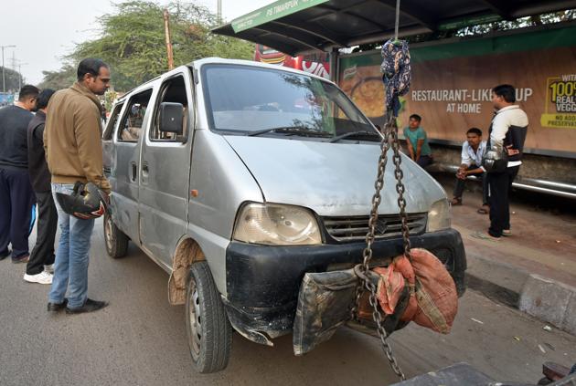 The school van, which was involved in an accident with a tempo resulting in the death of one student, is seen parked at Timarpur police Station in New Delhi on Tuesday.(Sushil Kumar/HT PHOTO)