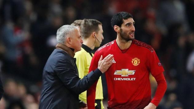 Manchester United's Marouane Fellaini celebrates after scoring with manager Jose Mourinho.(Action Images via Reuters)