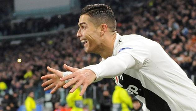 Juventus' Cristiano Ronaldo celebrates after his team’s victory over Valencia.(REUTERS)