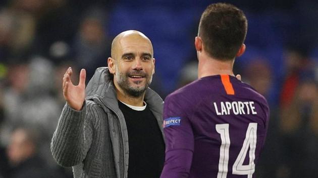 Manchester City manager Pep Guardiola and Aymeric Laporte celebrate after the latter scored against Lyon.(Action Images via Reuters)
