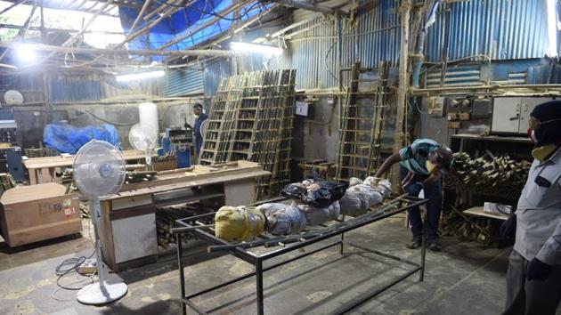 A worker tests the load bearing capacity of a funeral cot. Mehta purchased his kit from SarvaPooja, whose name translates to “prayers for all”. Its founder Nitesh Mehta, no relation to Parag, said he had sold around 2,000 kits since launching just under a year ago. The specific nature of Hindu ceremonies presented a gap in the market for a one-stop solution, Mehta said. (Indranil Mukherjee / AFP)