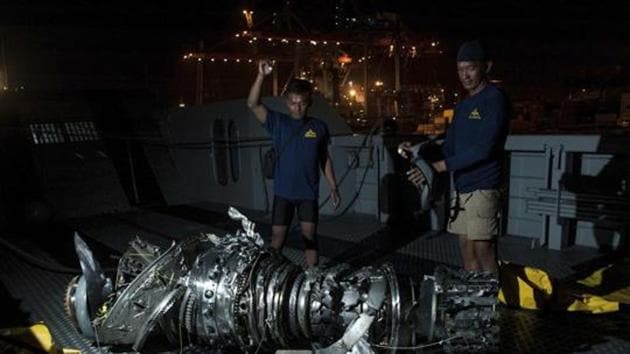 Navy divers inspect what is believed to be engine of the crashed Lion Air jet after it was retrieved from the sea floor, at Tanjung Priok Port in Jakarta, Indonesia.(AP file photo) Navy divers inspect what is believed to be engine of the crashed Lion Air jet after it was retrieved from the sea floor, at Tanjung Priok Port in Jakarta, Indonesia.(AP file photo)