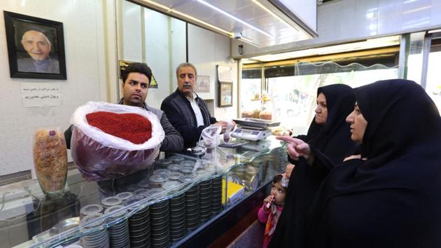 Iranians buy saffron at a shop in Khorasan province. Under a new “fair trade” scheme Shariati’s firm now organises loans on farmers’ behalf, bulk-buys equipment, and educates them on farming techniques. “We want them to deliver more organic saffron and improve their lives at the same time,” he said. (Atta Kenare / AFP) Iranians buy saffron at a shop in Khorasan province. Under a new “fair trade” scheme Shariati’s firm now organises loans on farmers’ behalf, bulk-buys equipment, and educates them on farming techniques. “We want them to deliver more organic saffron and improve their lives at the same time,” he said. (Atta Kenare / AFP)