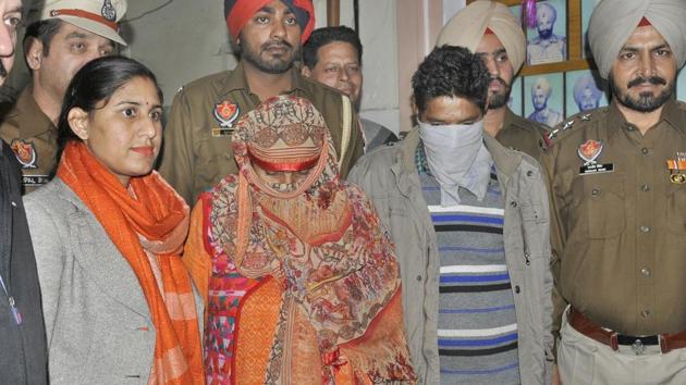 A couple from Jammu and Kashmir (faces covered), accused of smuggling over 10 kg heroin from PoK, was arrested by Special Task Force with heroin in Ludhiana on Tuesday, November 27, 2018.(Gurminder Singh / HT Photo) A couple from Jammu and Kashmir (faces covered), accused of smuggling over 10 kg heroin from PoK, was arrested by Special Task Force with heroin in Ludhiana on Tuesday, November 27, 2018.(Gurminder Singh / HT Photo)
