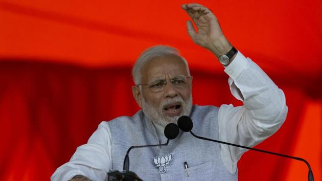 The “kamdar” is in a fight against the “naamdar” in Rajasthan, Prime Minister Narendra Modi said during an election rally, making a distinction between the one who works and the dynast in a jibe against Congress president Rahul Gandhi. Driving home the difference, Modi he said he was like the people and was not born with a golden spoon. (Mahesh Kumar A. / AP File) The “kamdar” is in a fight against the “naamdar” in Rajasthan, Prime Minister Narendra Modi said during an election rally, making a distinction between the one who works and the dynast in a jibe against Congress president Rahul Gandhi. Driving home the difference, Modi he said he was like the people and was not born with a golden spoon. (Mahesh Kumar A. / AP File)