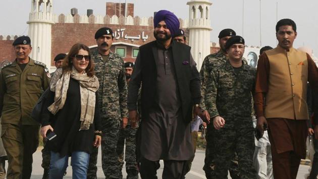 Navjot Singh Sidhu, center, arrives at the Pakistani border post Wagha near Lahore, Pakistan, Tuesday(PTI Photo) Navjot Singh Sidhu, center, arrives at the Pakistani border post Wagha near Lahore, Pakistan, Tuesday(PTI Photo)
