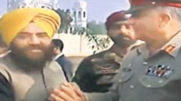 A video grab of Pakistan army chief Gen Qamar Javed Bajwa with pro­-Khalistan leader Gopal Singh Chawla at Kartarpur.