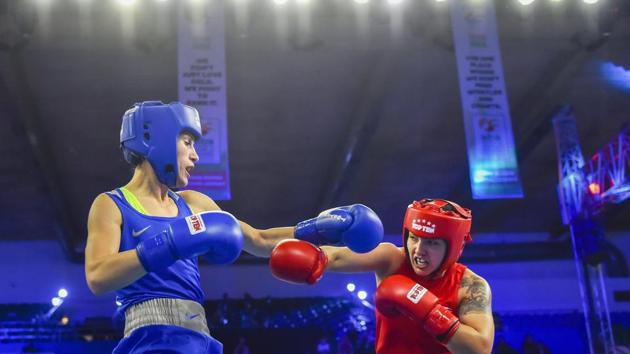 New Delhi: Stanimira Petrova (Blue) of Bulgaria fights with Rianna Rios of USA in womens' 57 kg category bout during AIBA Women's World Boxing Championships at IG Stadium in New Delhi, Saturday, Nov. 17, 2018(PTI)