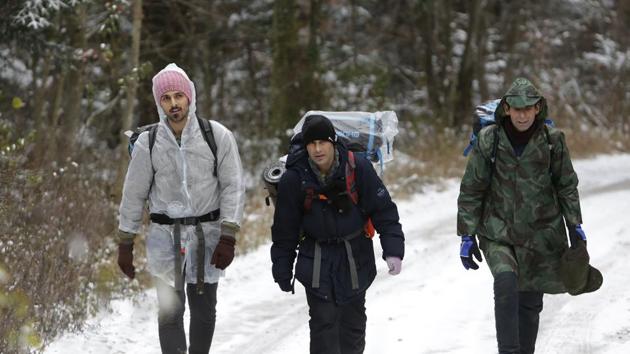 A group of migrants moves through a forest on the Pljesevica Mountain in Bihac, Bosnia. Braving cold weather and snow, dozens are heading daily up a steep mountain pass toward neighbouring Croatia, trying to slip by unnoticed by border guards or police. Carrying sleeping bags and personal belongings, the migrants tread slowly through the snow in groups, with some waving: “See you in Europe!” (Amel Emric / AP) A group of migrants moves through a forest on the Pljesevica Mountain in Bihac, Bosnia. Braving cold weather and snow, dozens are heading daily up a steep mountain pass toward neighbouring Croatia, trying to slip by unnoticed by border guards or police. Carrying sleeping bags and personal belongings, the migrants tread slowly through the snow in groups, with some waving: “See you in Europe!” (Amel Emric / AP)