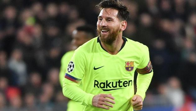 Barcelona's Argentine forward Lionel Messi reacts after his teammate Barcelona's Spanish defender Gerard Pique scores a goal during the UEFA Champions League football match between PSV Eindhoven and FC Barcelona(AFP)