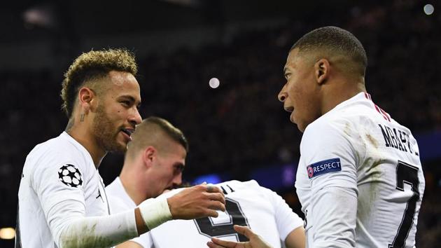 Paris Saint-Germain's forward Neymar (left) celebrates with Kylian Mbappe (right) after scoring against Liverpool.(AFP)