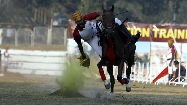 Cadets perform stunts during the PT and Equitation display at the convocation ceremony of the 135th course of national defence academy, on Thursday.  (RAHUL RAHUT/HT PHOTO) 
