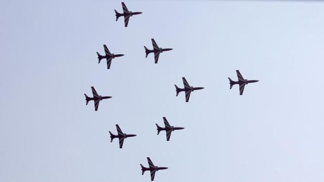 The Surya Kiran team flies nine aircraft in a Tejas formation at the convocation ceremony of the 135th course of national defence academy. (RAHUL RAUT/HT PHOTO) 