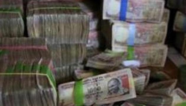 A pile of spiked Indian currency notes of 1,000 denomination are seen after they were deposited by people at a bank in Bangalore, India. The Congress which has attacked the Narendra Modi government over the Nov 8, 2016 note ban renewed its attack after former chief economic advisor Arvind Subramanian criticised the decision (File Photo) (AP) A pile of spiked Indian currency notes of 1,000 denomination are seen after they were deposited by people at a bank in Bangalore, India. The Congress which has attacked the Narendra Modi government over the Nov 8, 2016 note ban renewed its attack after former chief economic advisor Arvind Subramanian criticised the decision (File Photo) (AP)