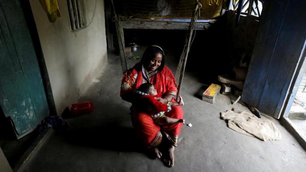 Mumtaz Bibi, 40, plays with her five-month-old granddaughter Nabina Khatun inside their house. “If a tsunami or a big cyclone hits this island we will be finished,” said Panchayat Sanjib Sagar, village leader on the island. (Rupak De Chowdhuri / REUTERS) Mumtaz Bibi, 40, plays with her five-month-old granddaughter Nabina Khatun inside their house. “If a tsunami or a big cyclone hits this island we will be finished,” said Panchayat Sanjib Sagar, village leader on the island. (Rupak De Chowdhuri / REUTERS)
