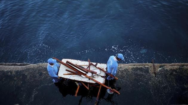 Workers remove wood and trash from the Mediterranean Sea. Littering is not Lebanon’s only problem. The country has a long-running solid waste management problem that caused summer riots in 2015 as trash piled in the streets. The government solved the problem by simply shifting the trash to landfills and coastal dumps that often run into the Mediterranean. (Hassan Ammar / AP) Workers remove wood and trash from the Mediterranean Sea. Littering is not Lebanon’s only problem. The country has a long-running solid waste management problem that caused summer riots in 2015 as trash piled in the streets. The government solved the problem by simply shifting the trash to landfills and coastal dumps that often run into the Mediterranean. (Hassan Ammar / AP)