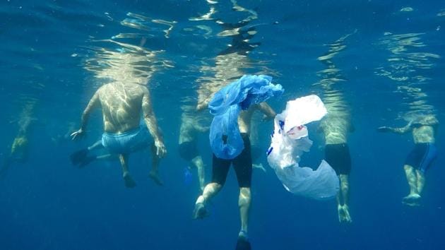 Plastic bags float as swimmers prepare to emulate sea creatures in an effort to send a message that pollutants such as bottles and plastic bags will entangle marine animals. A group of 50 swimmers, including Absi, recently organized the 4.6-km swim. “We see the violations are increasing and there is no deterrent,” Abis said. (Hassan Ammar / AP) Plastic bags float as swimmers prepare to emulate sea creatures in an effort to send a message that pollutants such as bottles and plastic bags will entangle marine animals. A group of 50 swimmers, including Absi, recently organized the 4.6-km swim. “We see the violations are increasing and there is no deterrent,” Abis said. (Hassan Ammar / AP)