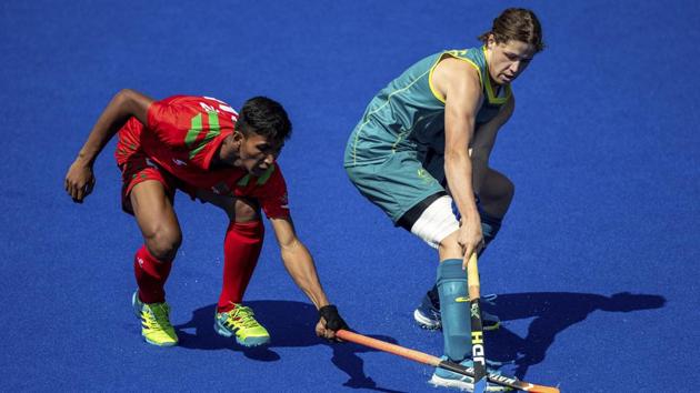 Sawon Sarower of Bangladesh and Ben White of Australia, contest the ball.(AP)