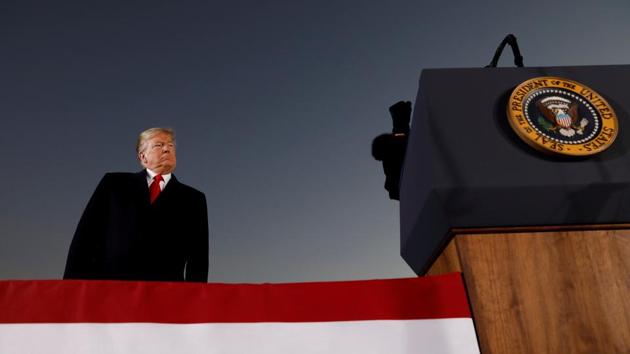 US President Donald Trump listens as Republican US Senator Cindy Hyde-Smith speaks at a Hyde-Smith campaign rally in Tupelo, Mississippi. (Kevin Lamarque / REUTERS) US President Donald Trump listens as Republican US Senator Cindy Hyde-Smith speaks at a Hyde-Smith campaign rally in Tupelo, Mississippi. (Kevin Lamarque / REUTERS)