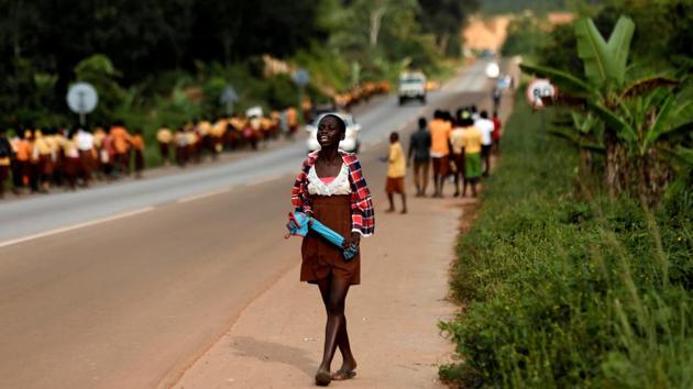 A girl reacts as she watches schoolchildren walking home near Princess town, Ghana. (Zohra Bensemra / REUTERS) A girl reacts as she watches schoolchildren walking home near Princess town, Ghana. (Zohra Bensemra / REUTERS)