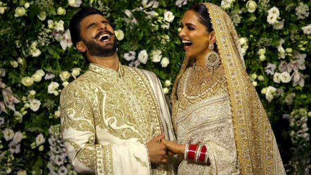 Bollywood actors Ranveer Singh and Deepika Padukone share a moment during a photo-op at their wedding reception in Mumbai, Maharashtra on November 28, 2018. (Francis Mascarenhas / REUTERS)