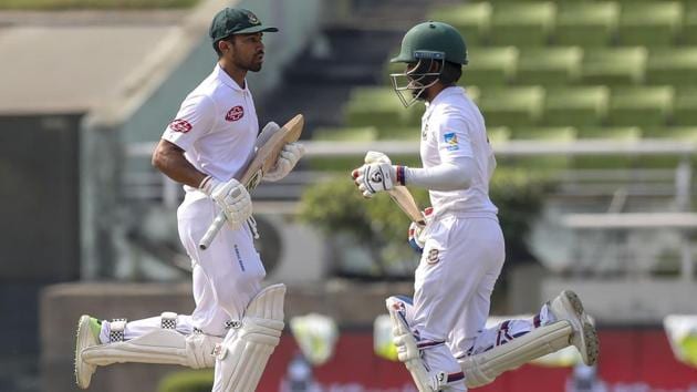 Bangladesh's Mominul Haque (R) and Shadman Islam (L) run between the wickets during the first day of the second Test cricket match between Bangladesh and West Indies in Dhaka on November 30, 2018.(AFP)
