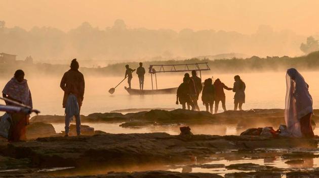 Silhouette of boatmen and others on a winter morning at the bank of river Narmada in Jabalpur, Madhya Pradesh on November 25, 2018. (PTI)
