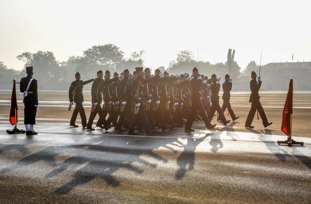 Parade advances in the reviewing order at Khetarpal parade ground on the passing out parade of the 135th course of National Defence Academy on Friday. (SANKET WANKHADE/HT PHOTO) 