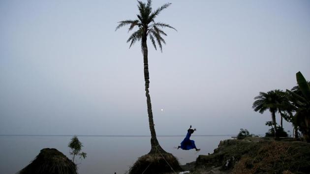 A girl plays on the coastline on Ghoramara Island. “There has to be some planning for those people, in terms of relocating them to other areas. Frankly speaking, this has to be in the plan of the government,” said Suruchi Bhadwal, a researcher on climate change at the New Delhi-based Energy and Resources Institute. (Rupak De Chowdhuri / REUTERS) A girl plays on the coastline on Ghoramara Island. “There has to be some planning for those people, in terms of relocating them to other areas. Frankly speaking, this has to be in the plan of the government,” said Suruchi Bhadwal, a researcher on climate change at the New Delhi-based Energy and Resources Institute. (Rupak De Chowdhuri / REUTERS)