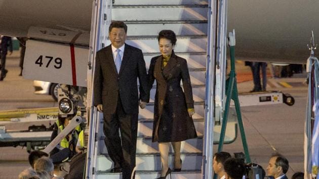Xi Jinping, China's president, center left, and Peng Liyuan, China's first lady, exit a plane as they arrive at Ezeiza Airport ahead of the G-20 Leaders' Summit in Buenos Aires, Argentina, on Thursday, November 29, 2018.(Bloomberg)