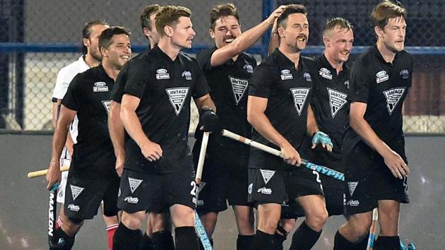 New Zealand (black) player Kane Russell celebrates with teammates after scoring a goal in a match against France (white) for Men's Hockey World Cup 2018, in Bhubaneswar.(PTI)