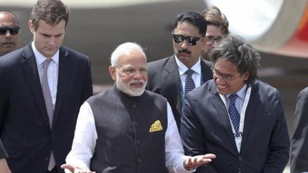 PM Narendra Modi gestures after he was welcomed by Argentina’s Justice Minister German Garavano, right, upon his arrival at the Ministro Pistarini international airport to attend the G20 Summit in Buenos Aires, Argentina on Thursday, November 29, 2018.(AP) PM Narendra Modi gestures after he was welcomed by Argentina’s Justice Minister German Garavano, right, upon his arrival at the Ministro Pistarini international airport to attend the G20 Summit in Buenos Aires, Argentina on Thursday, November 29, 2018.(AP)