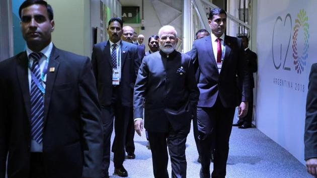 India's Prime Minister Narendra Modi (C) arrives for a bilateral meeting on the second day of the G20 Leaders' Summit in Buenos Aires, on December 01, 2018. - The leaders of countries representing four-fifths of the global economy opened a two-day meeting in Argentina facing the deepest fractures since the first G20 summit convened 10 years ago in the throes of financial crisis. (Photo by Ludovic MARIN / AFP)(AFP)