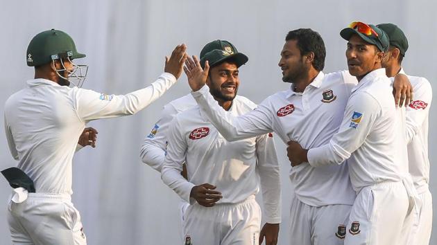 Bangladesh's Shakib Al Hasan celebrates with his teammates after the dismissal of West Indies' Kraigg Brathwaite during the second day of the second Test cricket match between Bangladesh and West Indies in Dhaka.(AFP)
