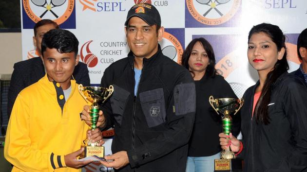 Ranchi: Former Indian cricket team captain MS Dhoni gives away a trophy to the winner of a tennis match at Jharkhand State Cricket Association (JSCA) International Cricket stadium, in Ranchi. (PTI) Ranchi: Former Indian cricket team captain MS Dhoni gives away a trophy to the winner of a tennis match at Jharkhand State Cricket Association (JSCA) International Cricket stadium, in Ranchi. (PTI)