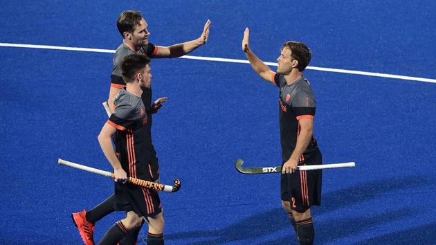 Jeroen Hertzberger of Netherlands celebrates with team mates after scoring the opening goal during the FIH Men's Hockey World Cup Pool D match between Netherlands and Malaysia at Kalinga Stadium. (Getty Images)