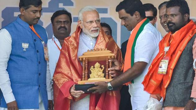 PM Narendra Modi is felicitated by his party workers and leaders during an election rally ahead of the Telangana Assembly Elections at Nizamabad on Tuesday, November 27, 2018. (PTI) PM Narendra Modi is felicitated by his party workers and leaders during an election rally ahead of the Telangana Assembly Elections at Nizamabad on Tuesday, November 27, 2018. (PTI)