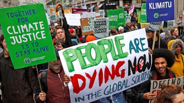 Climate change protesters demonstrate, prior to the United Nations climate change conference in Poland, in central London, Britain.(REUTERS)