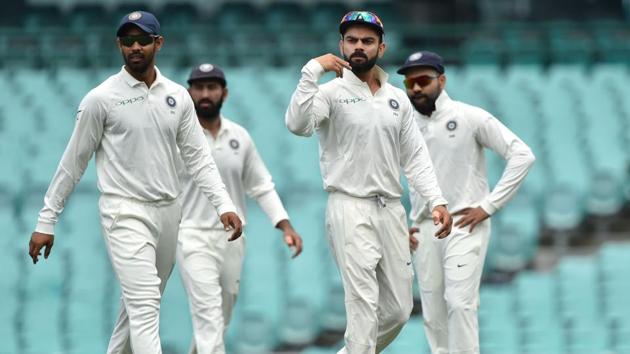India's captain Virat Kohli talks to players whilst fielding on the third day of the tour match against Cricket Australia XI. (AFP)