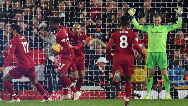 Jordan Pickford (R) reacts after his late mistake allows Liverpool's Belgian striker Divock Origi (2nd L) to score the winner.(AFP)