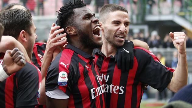 AC Milan's Franck Kessie, second from right, celebrates with his teammates after scoring his side's second goal.(AP)