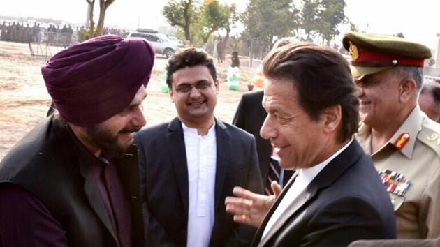 Pakistan's Prime Minister Imran Khan shakes hands with Navjot Singh Sidhu during ground breaking ceremony for Kartarpur corridor in Pakistan's Kartarpur, Nov. 28, 2018.(PTI Photo)