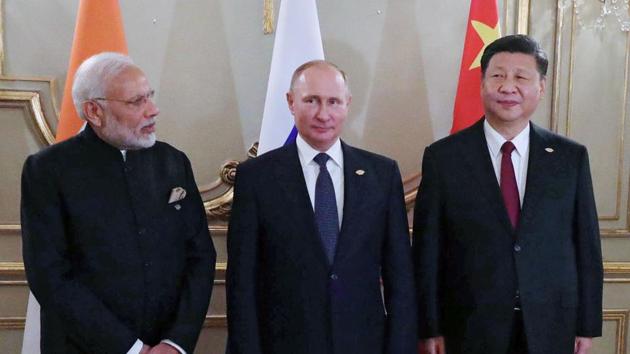 India's Prime Minister Narendra Modi (L), Russia's President Vladimir Putin (C) and China's President Xi Jinping, pose for pictures during a meeting in the sidelines of the G20 Summit in Buenos Aires, on November 30, 2018. (AFP) India's Prime Minister Narendra Modi (L), Russia's President Vladimir Putin (C) and China's President Xi Jinping, pose for pictures during a meeting in the sidelines of the G20 Summit in Buenos Aires, on November 30, 2018. (AFP)