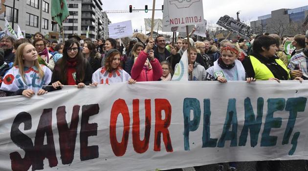 Demonstrators hold a banner which reads 'save our planet, save our future' during a 'Claim the Climate' march in Brussels, Sunday, Dec. 2, 2018.) (AP) Demonstrators hold a banner which reads 'save our planet, save our future' during a 'Claim the Climate' march in Brussels, Sunday, Dec. 2, 2018.) (AP)
