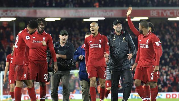 Liverpool coach Juergen Klopp (second from right) celebrates with the players after Divock Origi scored on Sunday. (AP) Liverpool coach Juergen Klopp (second from right) celebrates with the players after Divock Origi scored on Sunday. (AP)