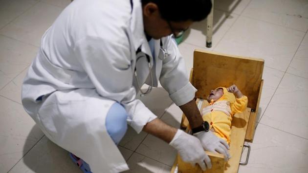 A doctor measures the length of a cholera-infected child at a treatment ward of al-Sabeen hospital in Sanaa. The United Nations says about 14 million people, or half of Yemen’s population, could soon face famine. Some 1.8 million children are malnourished, according to UNICEF. Children account for 30% of cholera infections. (Khaled Abdullah / REUTERS) 