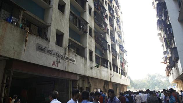 Onlookers outside the Samrat Ashok CHS, Mahalaxmi in Mumbai, where a fire killed a senior citizen, on Sunday, December 2, 2018. (Anshuman Poyrekar/HT Photo) Onlookers outside the Samrat Ashok CHS, Mahalaxmi in Mumbai, where a fire killed a senior citizen, on Sunday, December 2, 2018. (Anshuman Poyrekar/HT Photo)