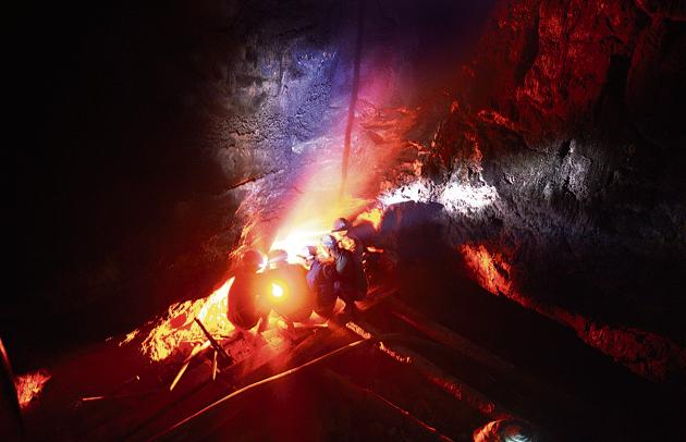 In a photograph dated January 29, 2013, miners keep warm by a fire inside a deep mine shaft near Rymbai village in Meghalaya. (AFP) In a photograph dated January 29, 2013, miners keep warm by a fire inside a deep mine shaft near Rymbai village in Meghalaya. (AFP)